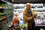 Neel Kashkari, president of the Federal Reserve Bank of Minneapolis, on his weekly grocery shopping trip at Lunds & Byerlys with his son, Tecumseh, 2.