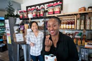 Junita Flowers, who owns Junita’s Jar, is one of the Center for Economic Inclusion forgivable loan recipients. She is pictured with Kayla Yang-Best 