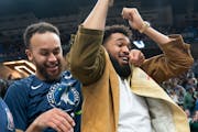Kyle Anderson and Karl-Anthony Towns celebrated a dunk by Naz Reid during a game last month.