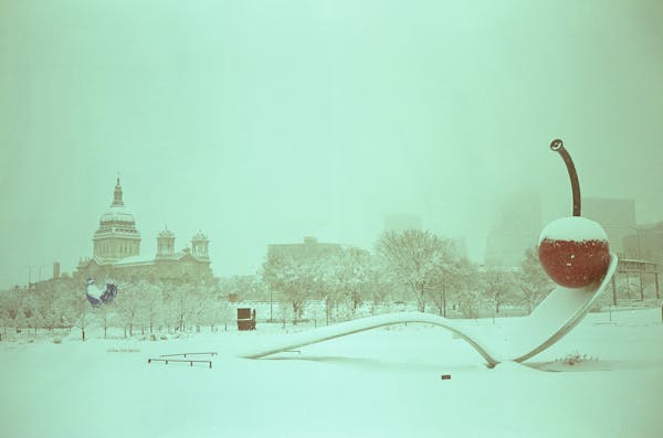 Snow falls on the Spoonbridge and Cherry sculpture Wednesday, Jan. 4, 2023 at the Minneapolis Sculpture Garden in Minneapolis. This photo was made wit