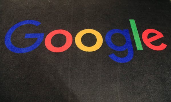 FILE - The logo of Google is displayed on a carpet at the entrance hall of Google France in Paris, on Nov. 18, 2019. Google said Friday, jan. 20, 2023