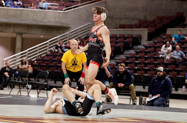 Ryder Rogotzke left Connor Mirasola of West Bend, Wis., flat on the mat during the Christmas Tournament in Rochester.