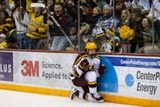 Gophers forward Matthew Knies celebrated his goal with 8.8 seconds left in overtime to beat Michigan on Friday night at 3M Arena at Mariucci.