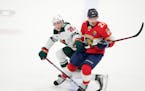 Wild center Connor Dewar and Panthers center Nick Cousins battled in the third period Saturday night in Sunrise, Fla.