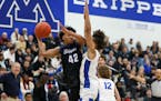 Minnetonka’s Ibrahim El-Amin looked to pass Friday against Hopkins in a matchup of Metro Top 10 teams. El-Amin also did some shooting, leading his t