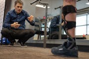 Dr. Yakov “Jacob” Gradinar, watched as Ukrainian soldier Roman Hrhorian, took steps on his new prosthetic leg at the Protez Foundation Jan. 19 in 