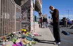 Kenny Loo, 71, prays outside Star Dance Studio for the victims killed in Saturday’s shooting in Monterey Park, Calif.