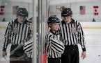 Sibling referees Sedona Stumpf and D.J. Stumpf chatted during a break in officiating youth hockey games Friday.