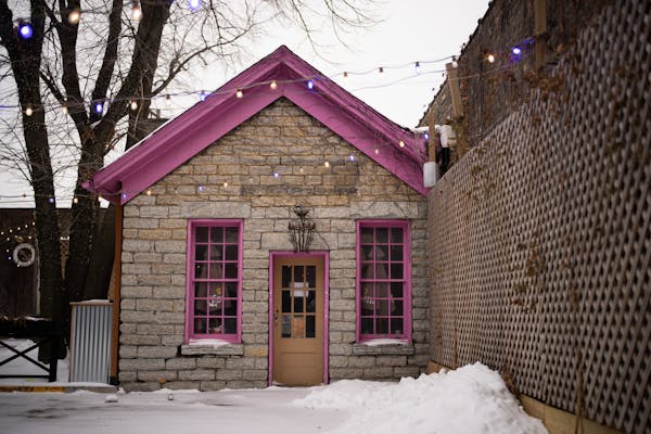 The Justus Ramsey House on the patio adjacent to Burger Moe’s on W. 7th St., Monday, Dec. 5, 2022, in St. Paul, Minn.