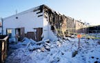 The Red Bird Music Store, right, was destroyed and the Natural Heritage Art Centre, left, damaged in a Jan. 18, 2023, fire in the business block on th