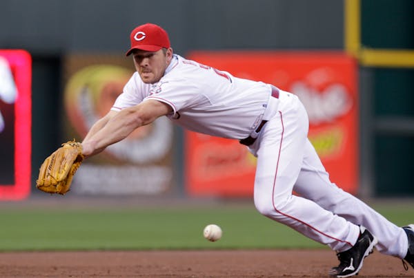 Scott Rolen dives for a ball during a game in 2010.