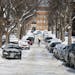 A pedestrian walked across S. Garfield Avenue in Minneapolis on Wednesday, Feb. 27, 2019, days after parking was banned on the even side of the street