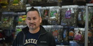 José Hernández, owner of La Petaca in Minneapolis, with some of the medicinal herbs he sells to help with kidney stones. 