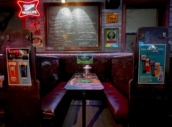 The graffiti-decorated booths at Mayslack’s are filled with memories from drinkers past. Some more colorfully worded than others.