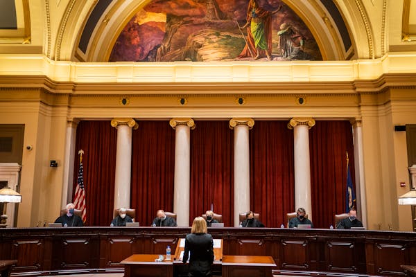 Minnesota Supreme Court Chief Justice Lorie Skjerven Gildea, center, and the Associate Justices listened during oral arguments in a case before the Mi