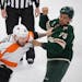Minnesota Wild right wing Ryan Reaves (75) and Philadelphia Flyers left wing Nicolas Deslauriers (44) fought  in the first period. The Minnesota Wild 