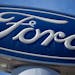 FILE - This Oct. 24, 2021 file photo shows a Ford company logo on a sign at a Ford dealership in southeast Denver. Ford is recalling nearly 383,000 SU