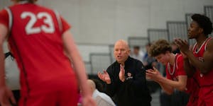 Eden Prairie coach David Flom talked to his team during a first-half timeout on Tuesday when he returned to coaching after a six-week suspension.