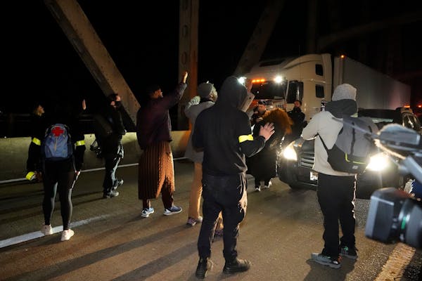 Protesters took over a bridge Friday in Memphis, Tenn., as authorities release police video depicting five Memphis officers beating Tyre Nichols. 