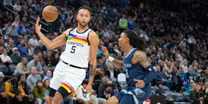 Timberwolves forward Kyle Anderson threw a no-look pass to Jaden McDaniels past Grizzlies guard Ja Morant in the fourth quarter Friday