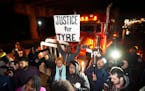 Protesters marched down a street Friday in Memphis, Tenn., as authorities released police video depicting five Memphis officers beating Tyre Nichols.
