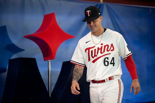 Jose Miranda posed in the Twins’ new home white uniforms when they were revealed at the Mall of America in November.