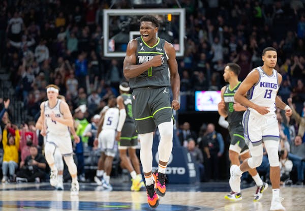 Timberwolves guard Anthony Edwards reacts after hitting a three-point-shot with 16 seconds left in the game to ice the victory.