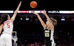 Purdue guard Abbey Ellis shot over Ohio State guard Emma Shumate during the first half Sunday. Ellis made a season-high five three-pointers in the Boi