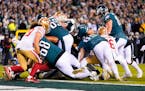 Eagles quarterback Jalen Hurts followed a powerful line surge to score a touchdown in the second half of the NFC Championship Game on Sunday. The Eagl
