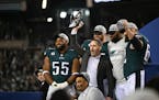Philadelphia Eagles General Manager Howie Roseman, center, celebrates with the players after beating the San Francisco 49ers.