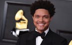 FILE - Trevor Noah appears at the 63rd annual Grammy Awards in Los Angeles on March 14, 2021. Noah is hosting the Grammy Awards for a third-straight y