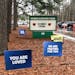FILE - Signs stand outside Richneck Elementary School in Newport News, Va., on Jan. 25, 2023. The school is set to reopen Monday, Jan. 30, more than t