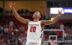 Texas Tech’s Jaylon Tyson (20) tries to get the crowd to yell during overtime of an NCAA college basketball game against Iowa State, Monday, Jan. 30