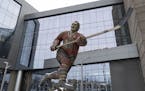 The statue of Bobby Hull sits outside the United Center after the Blackhawks announced his death on Monday.