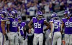A group of Minnesota Vikings players huddle on the field during the second half of an NFL football game against the Indianapolis Colts, Saturday, Dec.