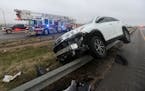 A vehicle rests on a barricade as the driver lost control and slid off Highway 6 on Tuesday Jan. 31, 2023 in Waco, Texas. 