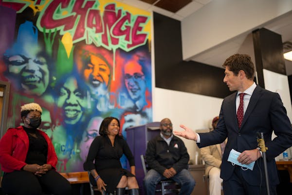 Minneapolis Mayor Jacob Frey at the press conference announcing the business incubator that is a partnership between Kenya McKnight-Ahad (center) and 