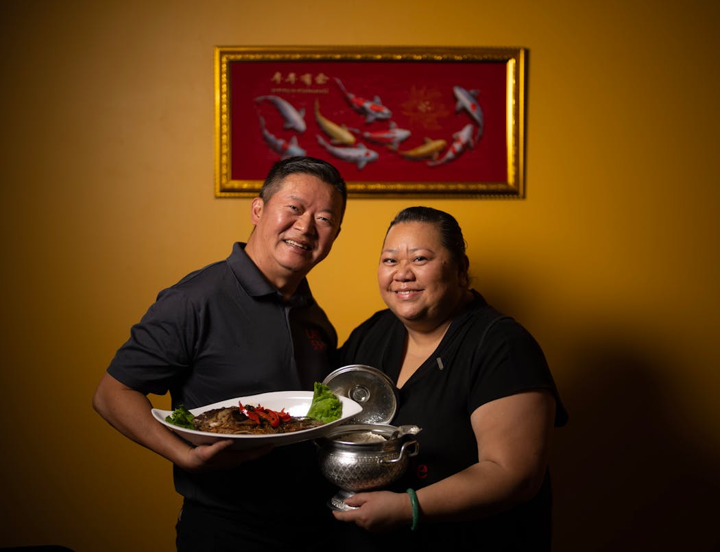 Thai Cafe owners Lao Vue and chef Lynn Her with the fried fish laab.