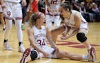 Indiana’s Grace Berger (34) celebrated with Mackenzie Holmes after Berger took a charging foul during last Thursday’s victory against Ohio State.