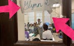 Emmitt Glynn is seen from just outside his classroom at Baton Rouge Magnet High School teaching his second AP African American studies class on Monday