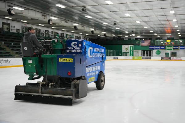 Arena maintenance coordinator Hunter Sieve drove a Zamboni while cleaning a sheet of ice at Braemar Arena in Edina on Tuesday. Edina is trying to hire