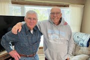 Former Minnesota Duluth player and coach Mike Sertich, right, with friend and longtime Bulldogs supporter Dave Zentner, shown during a visit this week