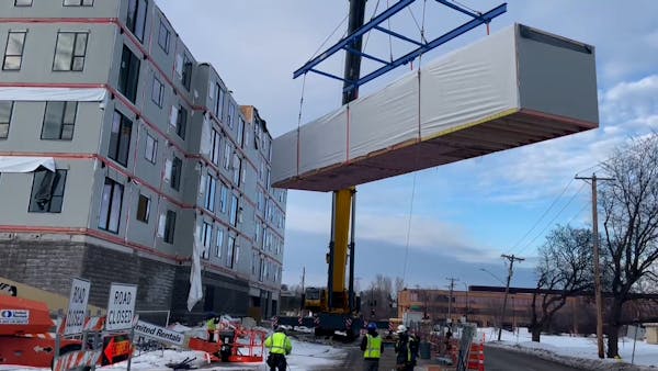 Watch an apartment building made of 'mods' rise in Edina