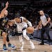 Stephen Curry (30) of the Golden State Warriors defends D’Angelo Russell (0) of the Minnesota Timberwolves in the first quarter Wednesday, February 