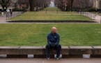 Christopher McNaughton sits on the campus of Penn State University. He has been battling United Healthcare for coverage of his treatment for ulcerativ