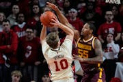 Gophers guard Ta’lon Cooper defended a shot by Rutgers’ Cam Spencer during Wednesday’s road loss.