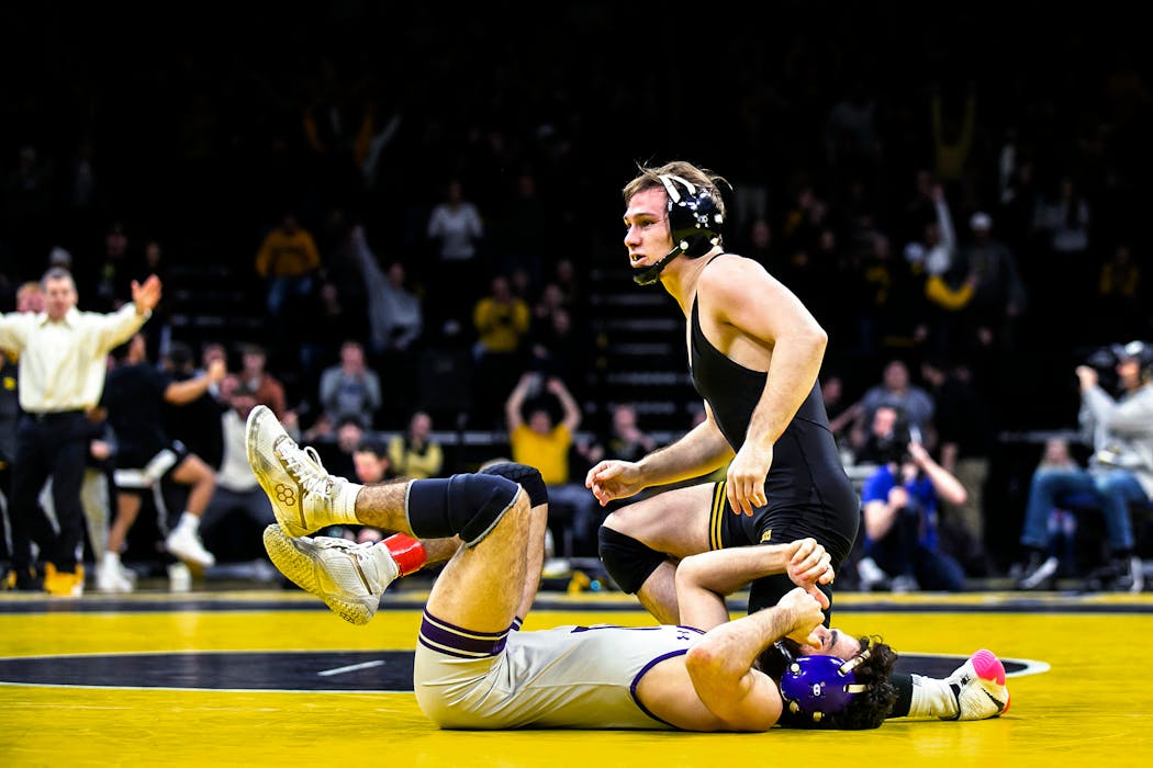 Iowa’s Spencer Lee left a defeated Michael DeAugustino from Northwestern on his back following their dual Jan. 13.