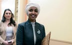 Rep. Ilhan Omar, D-Minn., left the House chamber on Thursday after House Republicans voted to oust her from the Foreign Affairs Committee.