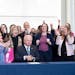 Surrounded by DFL legislators, Minnesota Gov. Tim Walz, center, signs a bill to add a “fundamental right” to abortion access into state law on Tue