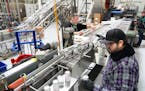 Packing line operator Christopher Coughlin works quality control as Clr!ty THC infused seltzers are canned Thursday, Feb. 2, 2022 at the Fulton produc